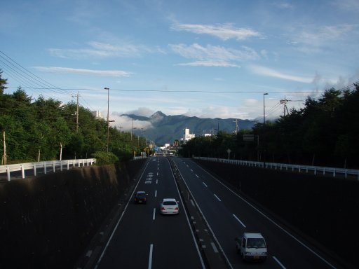 Crossing a highway bridge walking toward Mount Fuji from Kawaguchiko.