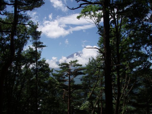Mount Fuji peaking out at Mount Tenjo in Kawaguchiko Japan.