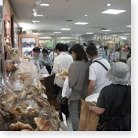 Japanese in line at grocery store.