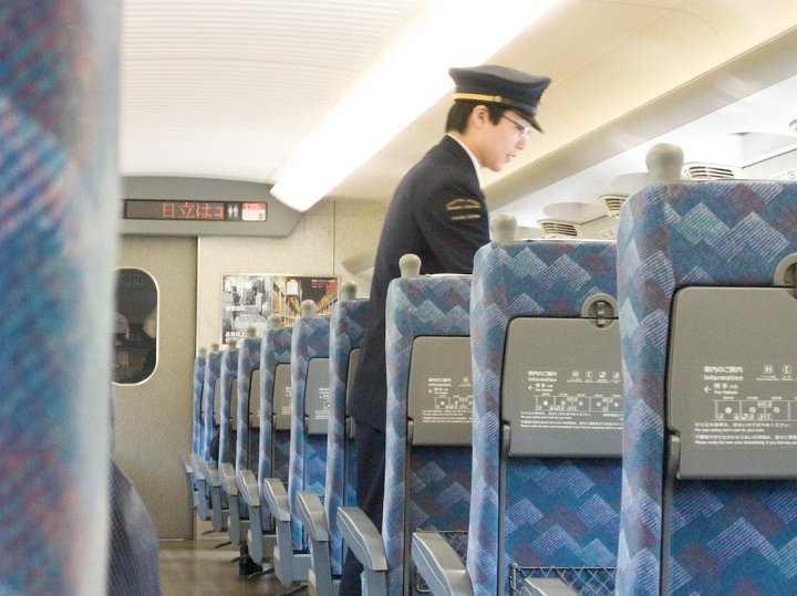 Shinkansen conductors verify passenger seating--sommetimes doing visual checks against a list, other times checking tickets.