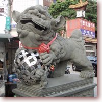 playful lion statue guard temple in taiwan