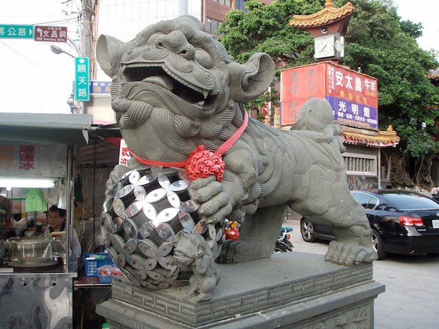 Playful lions guard the temple courtyard of the goddess Matsu, protector of those who go to sea. It is located in the Dajia District of Taichung, Taiwan.