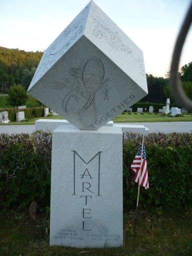 The cubic graves of T. Paul Martel and Janet M. Martel in the Hope Cemetery located in Barre, Vermont, has engravings on all surfaces.