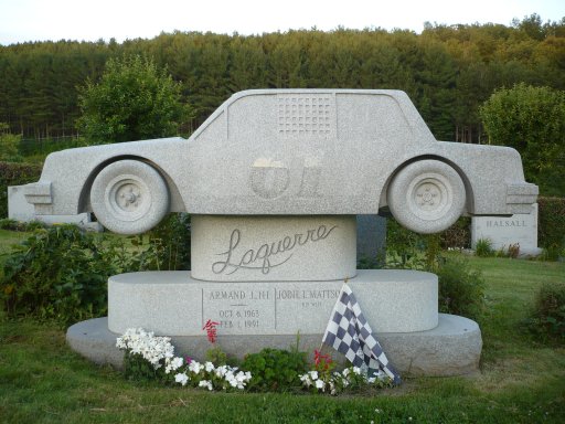 The grave of Armand J. Laquerre in the Hope Cemetery located in Barre, Vermont shows the young man was an enthusiast of fast cars. He died at 28 years of age. His marker is made of Barre gray granite, as are most of the monuments in the Hope Cemetery.