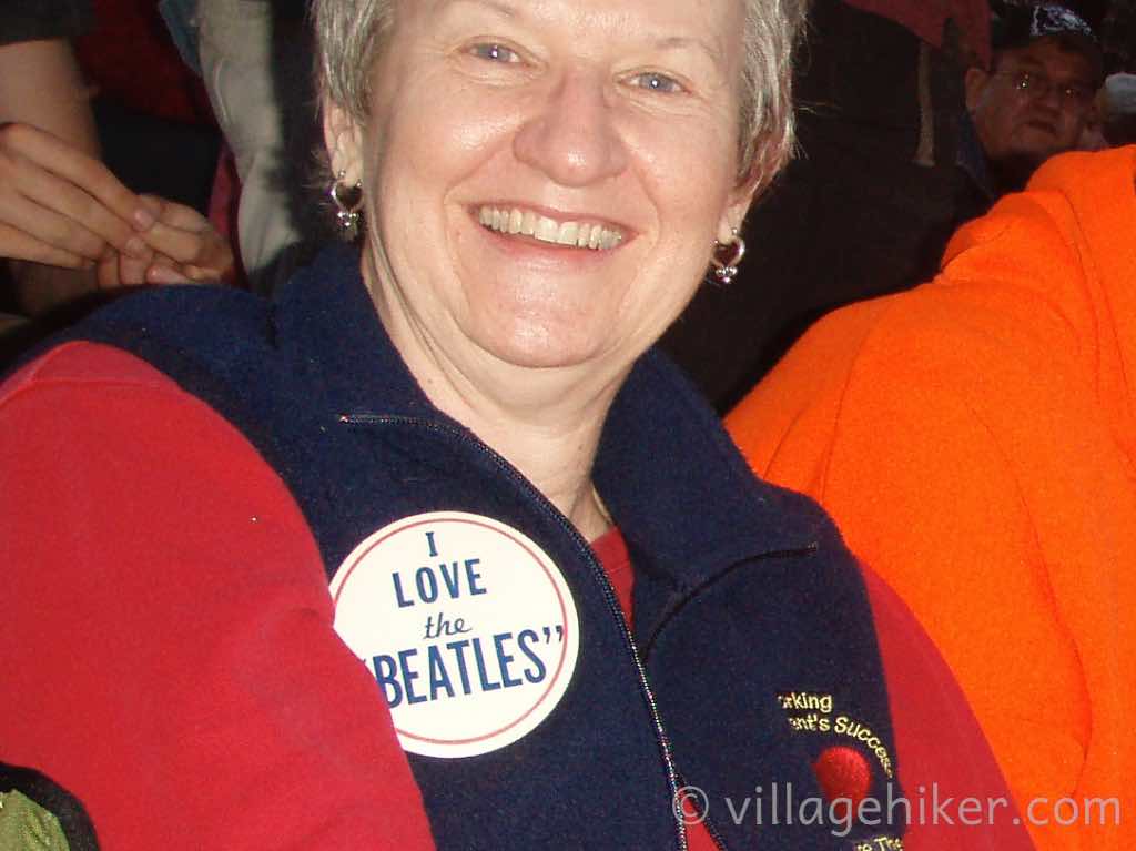 A fan sports an button saying I Love the Beatles.