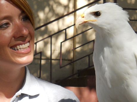 Lakota and Lindsey, hawk and handler, after the Kroger Birds of the World Show at the State Fair of Texas in 2010. Lakota is a pure white red-tailed hawk.