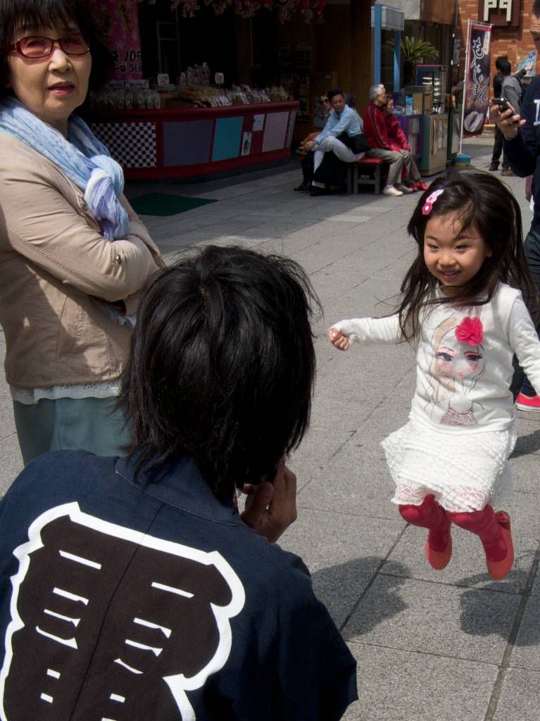 Cute Japanese Girl Jumps for Happiness During Cherry Blossom Season 2013