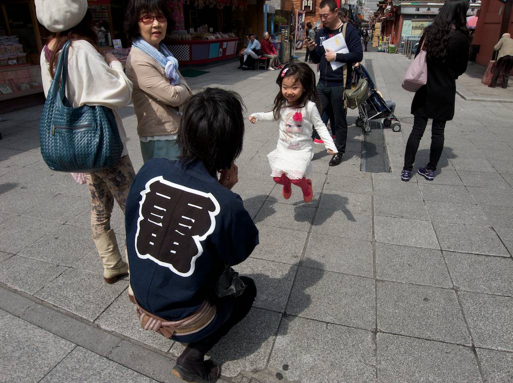 Cute Japanese Girl Jumps for Happiness During Cherry Blossom Season 2013