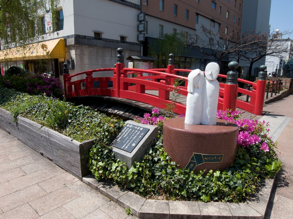 Harimaya Bridge. The stone statue immortalizes the true love story between a Buddhist priest and young woman who fell for each other which was forbidden. They met at Harimaya Bridge before being banished to separate locations. 