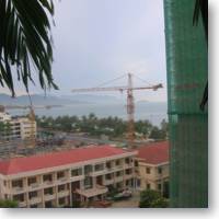 crane raises above a building in vietnam.